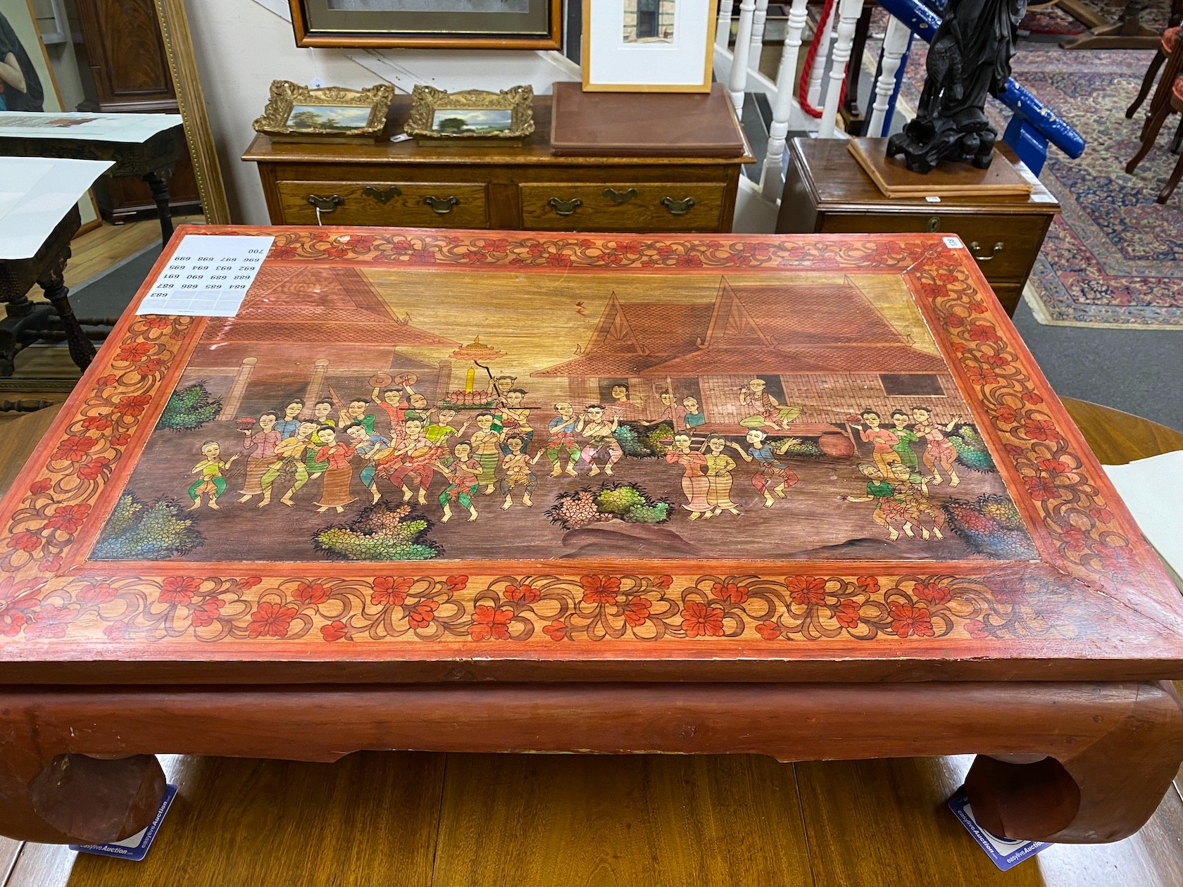 A rectangular painted Thai coffee table width 119cm, depth 79cm, height 40cm
